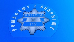 Za zdjęciu napis Policja - pomagamy i chronimy